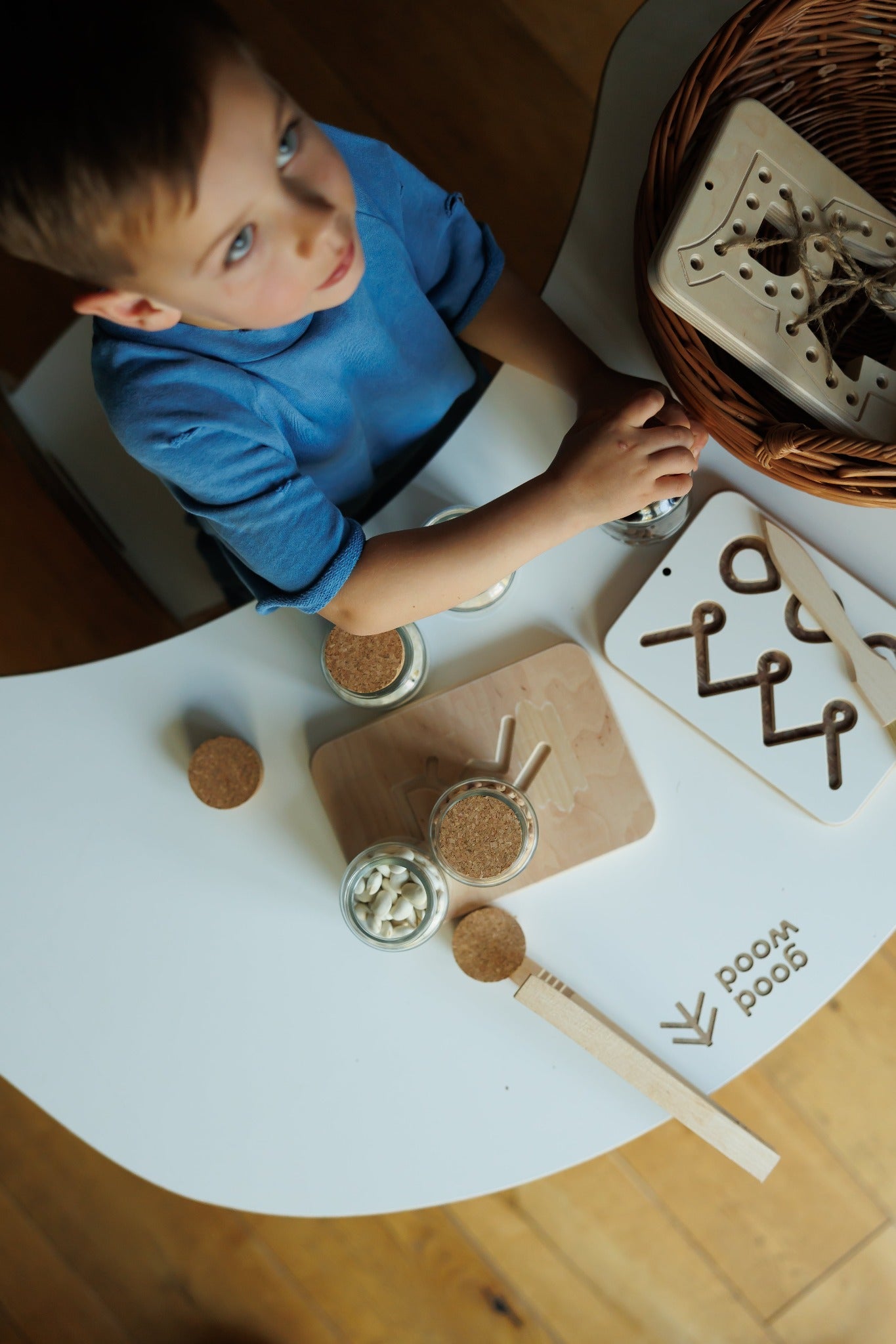 a boy playing good wood preschool wooden board