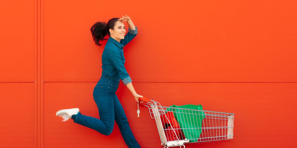 woment with the trolley on the orange wall