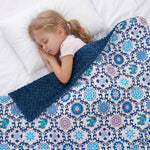 A girl sleeping under the mandala printed weighted blanket
