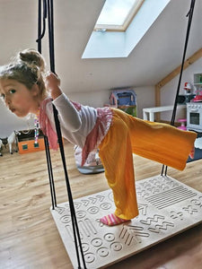 girl swinging SENSORY PLATFORM- GOOD WOOD