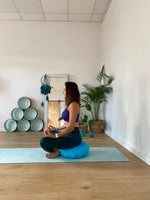 women siting on zafu pillow made by sensory owl